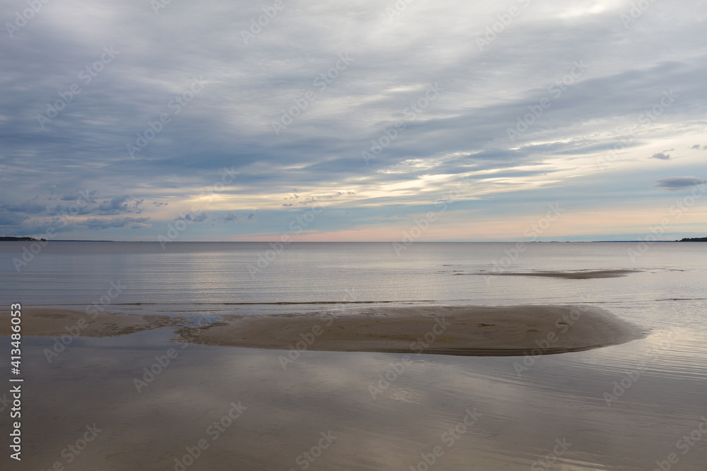 Dense clouds in the sky over calm sea with sunlight reflection. Minimalistic photo Dense clouds in the sky over calm sea with sunlight reflection. Minimalistic photo