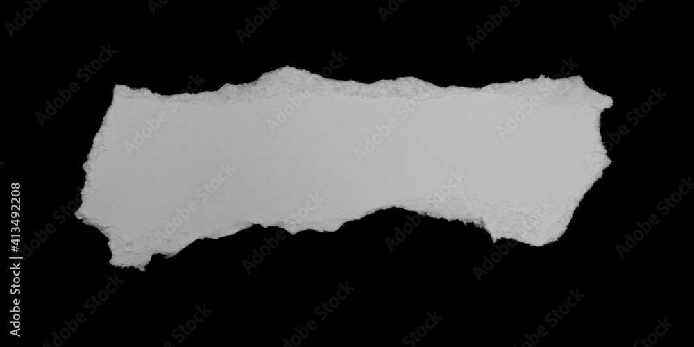 Ripped paper on black background, space for advertising copy. Ripped paper on black background, space for advertising copy.