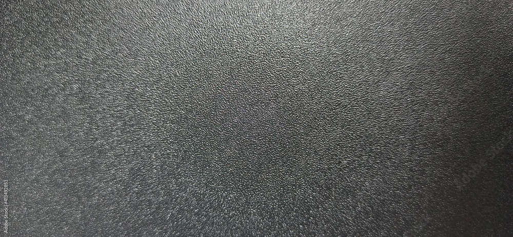 Obraz premium Black rough surface with highlights 