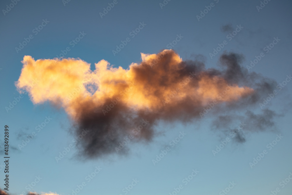 View of evening clouds back lit by sunset light