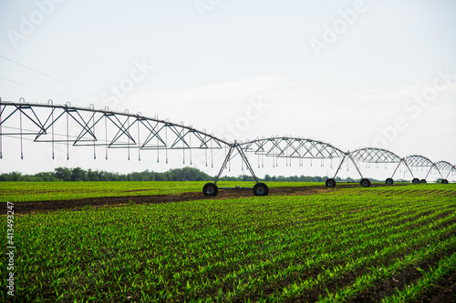 Modern agricultural irrigation system spraying in field © SGr