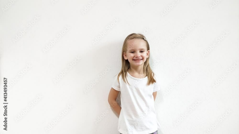 Happy laughing little girl, she is fooling around and smiles. She makes faces and shows emotions, real time. Happy laughing little girl, she is fooling around and smiles. She makes faces and shows emotions, real time.