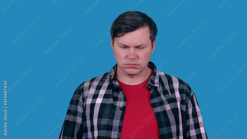 The depressed man stands and looks down. The depressed man stands and looks down.
