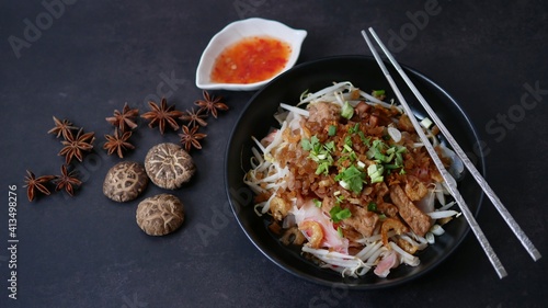 Rice flat noodle with dried shrimp,  ground pork, squid, tofu and beansprout in sweet black soy sauce, Thai called Kuay Teow Lord