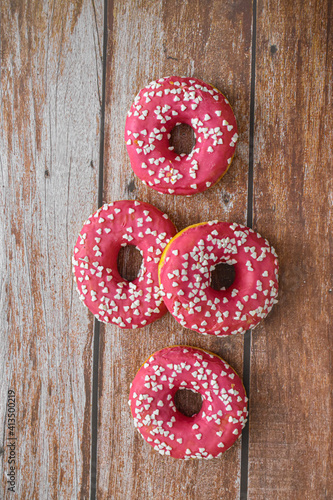 Donuts on wooden background. Food concept. American junk food