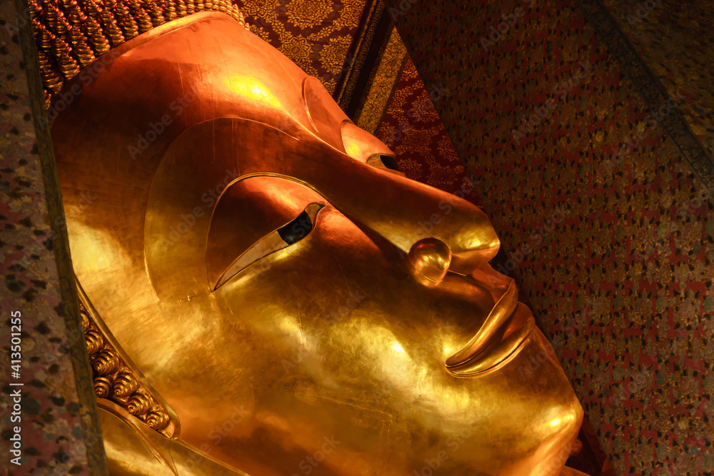 The golden elegant is on the Buddha's face