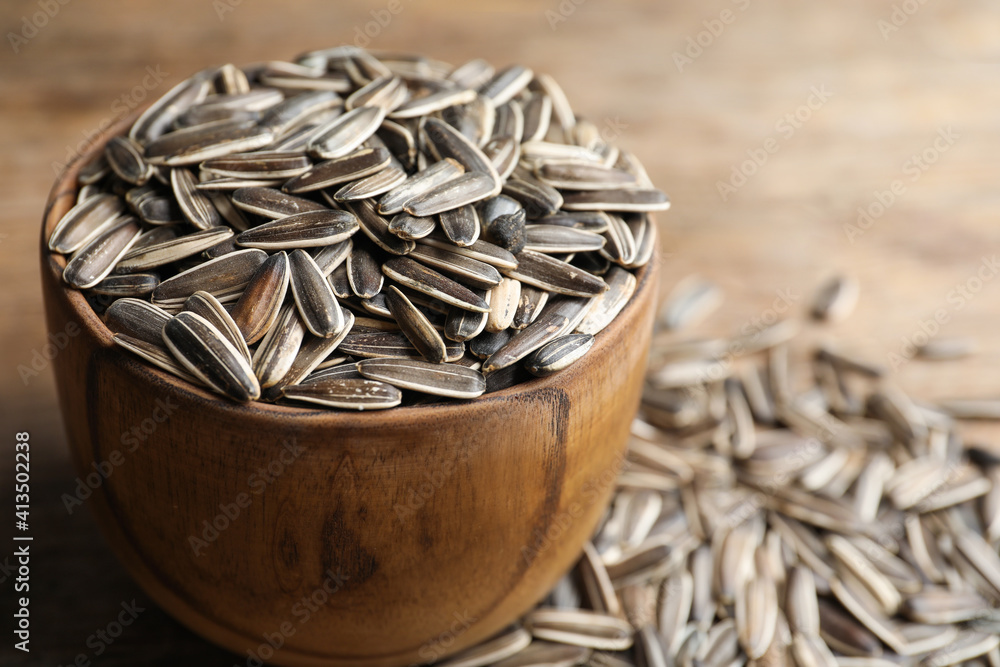 Raw sunflower seeds on table, closeup view Raw sunflower seeds on table, closeup view