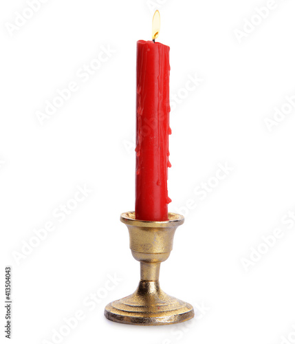 Glowing wax candle on white...