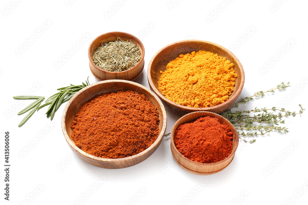 Bowls with different spices and herbs on white background Bowls with different spices and herbs on white background