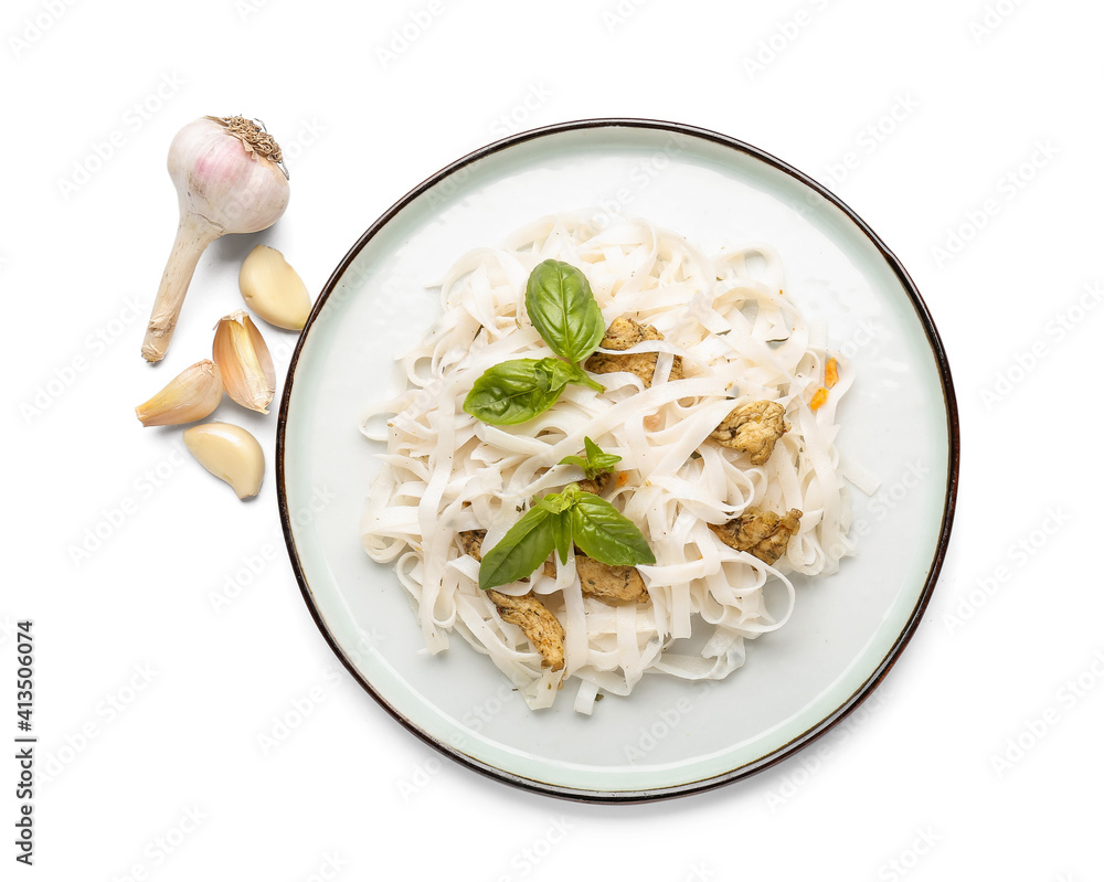 Plate with tasty noodles, chicken and garlic on white background Plate with tasty noodles, chicken and garlic on white background