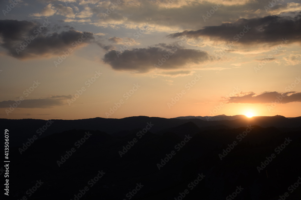 Sunset with cloudy sky