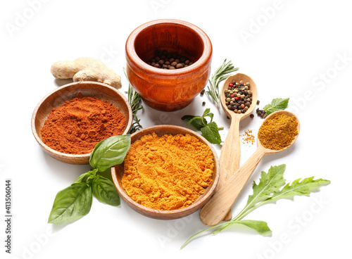 Bowls with different spices and herbs on white background