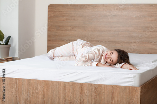 Fotografie, Obraz Morning of beautiful young woman lying on bed with soft mattress