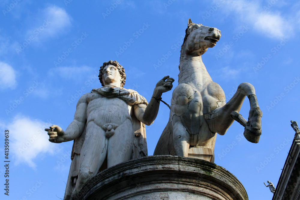 Obraz premium Marble statue of Polluce Dioscuri. The sculpture is located on Michelangelo Cordonata stairs and leading to Piazza del Campidoglio. Rome, Italy