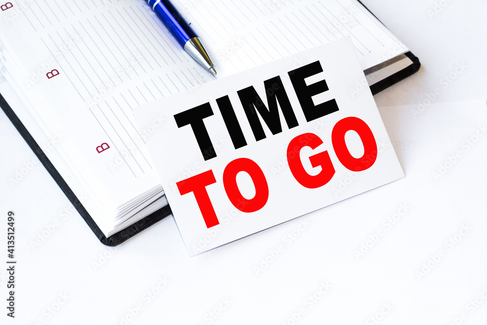 Text TIME TO GO on financial tables, the working paper . Business and financial conzept. Text TIME TO GO on financial tables, the working paper . Business and financial conzept.