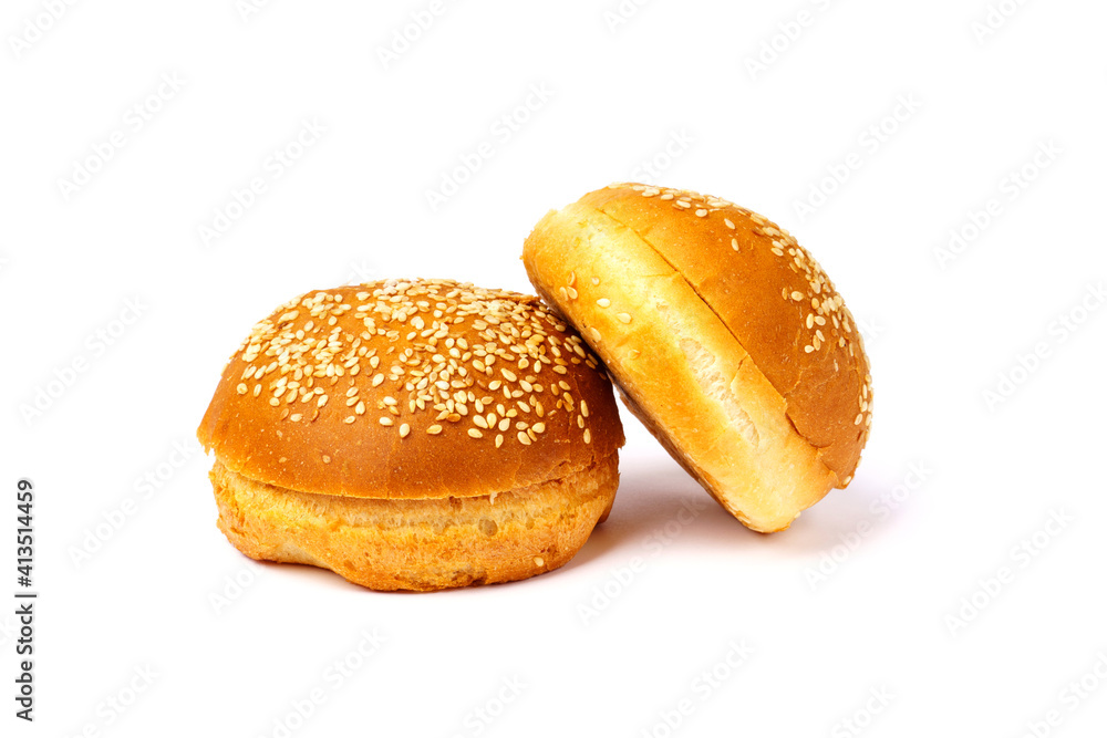 Two hamburger buns with sesame seeds isolated on a white