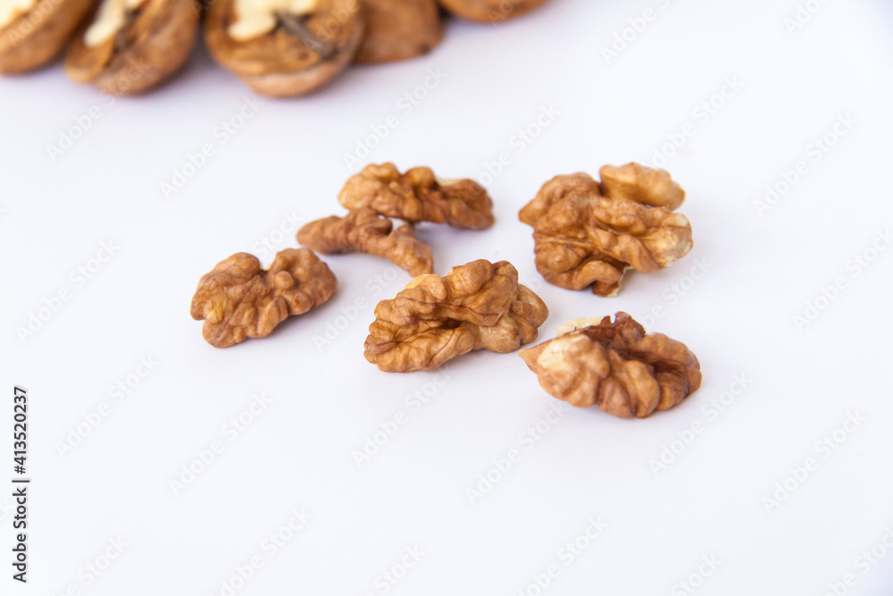 Walnuts in a shell on a white background. Healthy nuts. Walnuts in a shell on a white background. Healthy nuts.