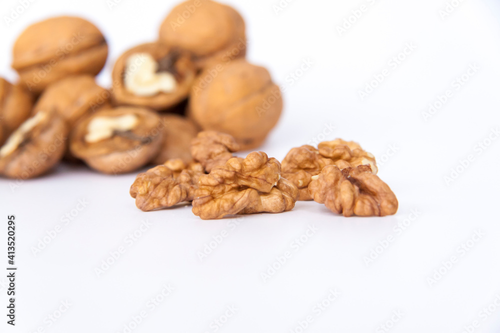 Walnuts in a shell on a white background. Healthy nuts. Walnuts in a shell on a white background. Healthy nuts.