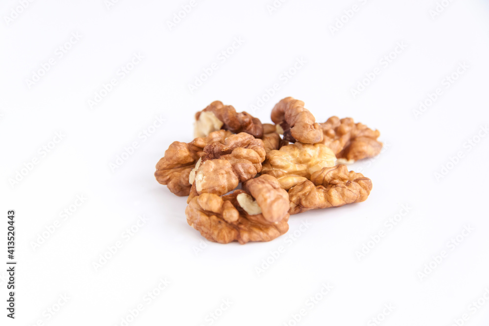 Walnuts without shells on a white background. Healthy nuts. Walnuts without shells on a white background. Healthy nuts.