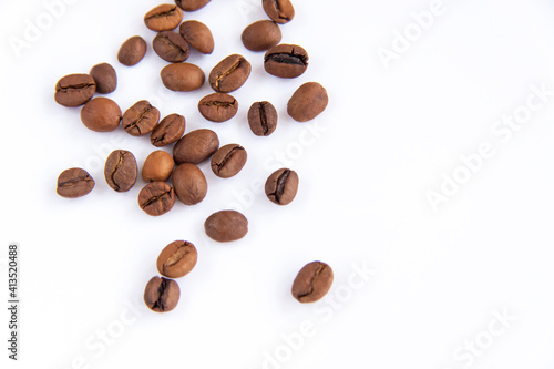 Coffee beans on a white background. Roasted coffee beans.