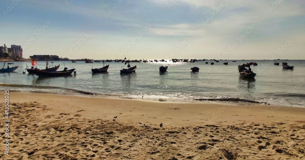 Fishing boats near Front Beach. Coastline of Vung Tau. Sea and sandl. Vietnam. South-East Asia	