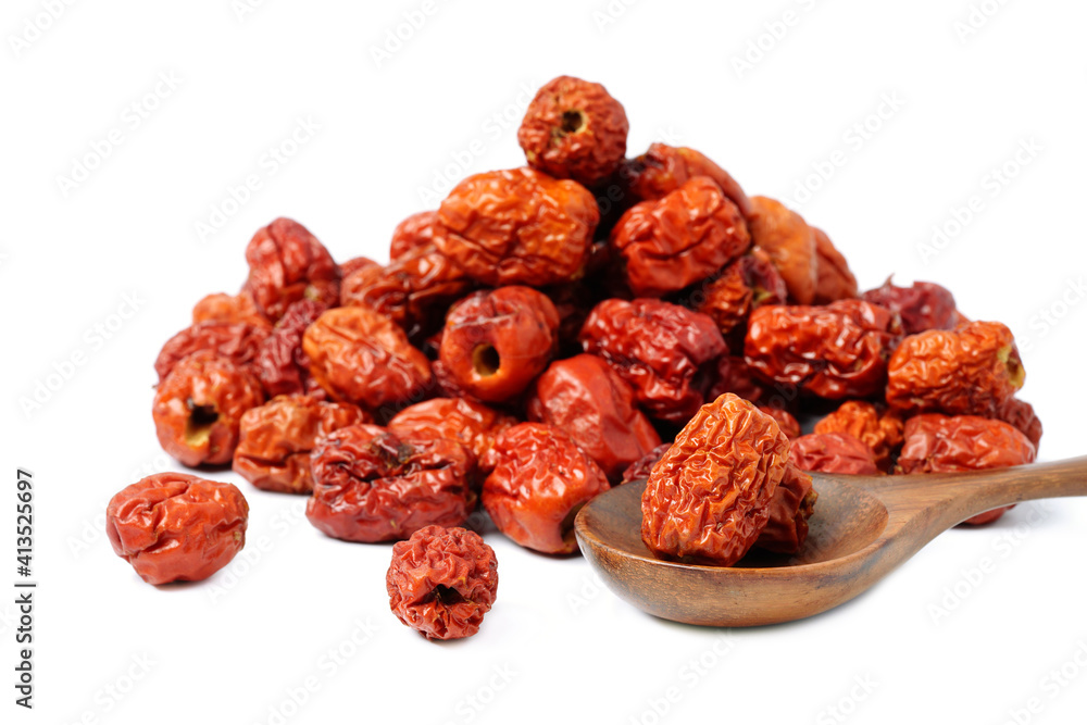 dried unabi fruit or jujube in wood spoon of on white background. copy space for text. dried unabi fruit or jujube in wood spoon of on white background. copy space for text.