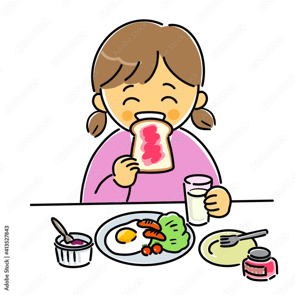 朝食のパンをうれしそうに食べる女の子 朝食のパンをうれしそうに食べる女の子