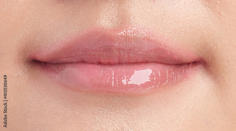 Fototapeta premium closeup Lips, Beautiful young woman with pink lipstick,