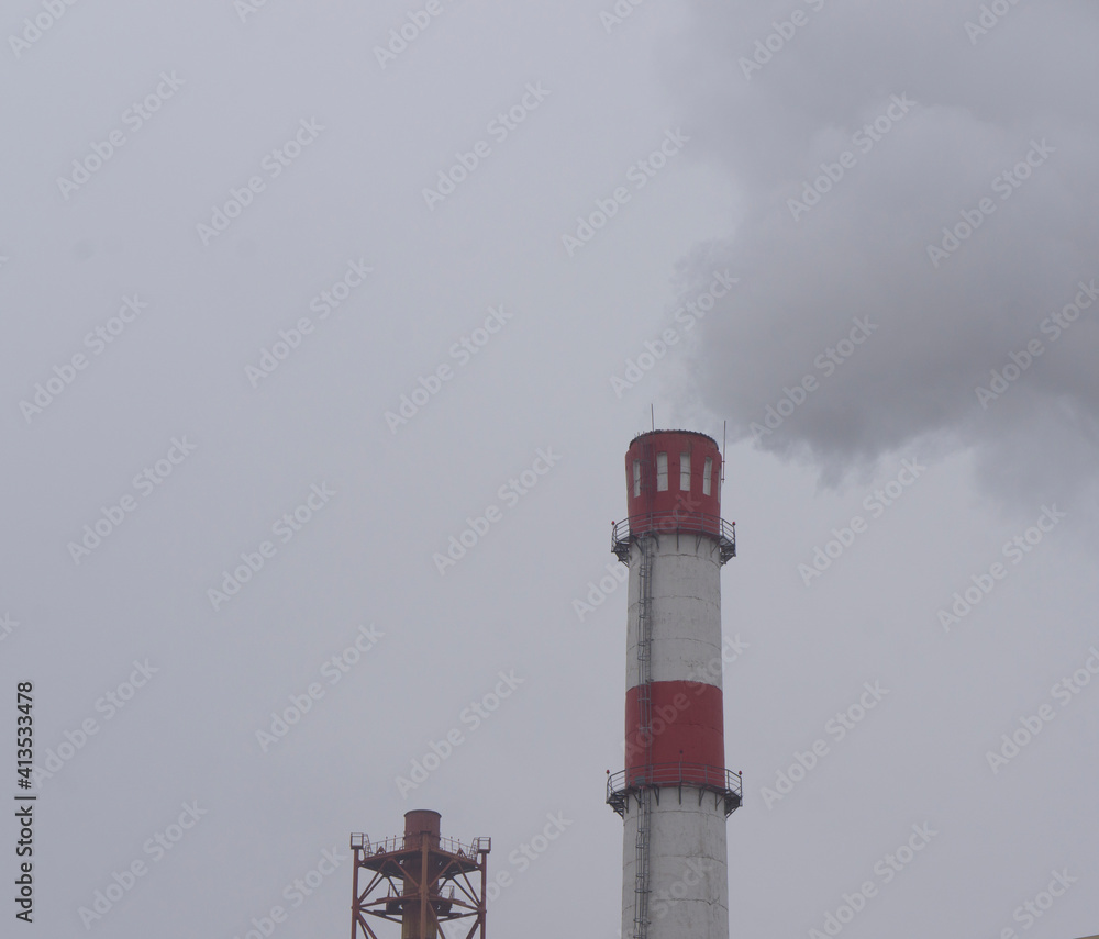 Industrial plant chimney polluting the atmosphere