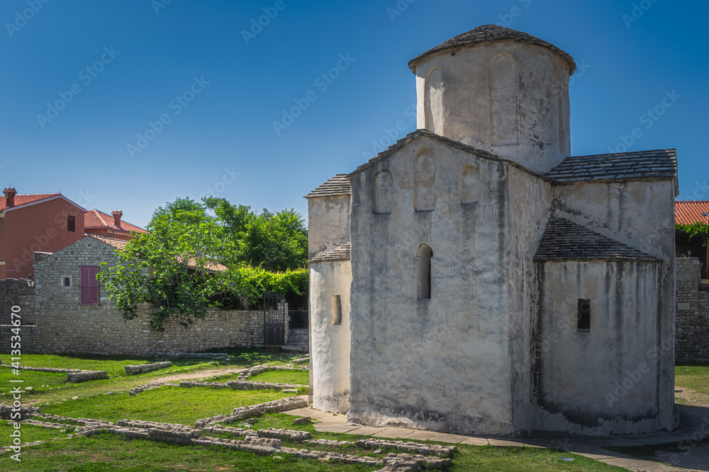 Ancient, dated on 9th century, Church of the Holy Cross in Romanesque style architecture, located in old district of Nin town on small island, Croatia
