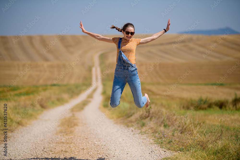 girl on the road with wheat field girl on the road with wheat field