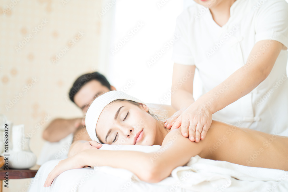 Young woman relaxing with hand spa massage at beauty spa salon Young woman relaxing with hand spa massage at beauty spa salon