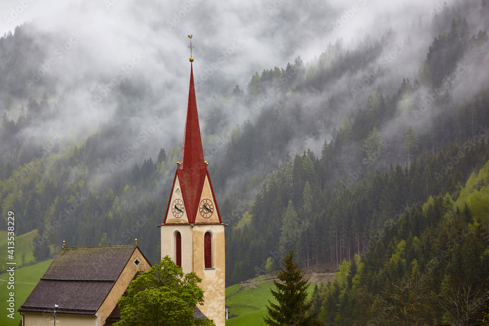 South Tyrol impressions, church in Innerratschings in the early morning fog, (Italy)