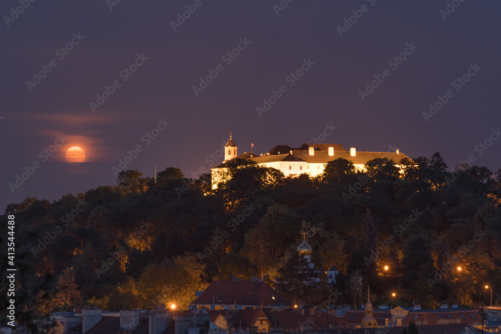 Moonrise over Spilberk castle on a cloudy night. Brno, South Moravia, Czech republic, Europe. Moonrise over Spilberk castle on a cloudy night. Brno, South Moravia, Czech republic, Europe.