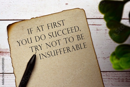 Принти на полотні Motivational and inspirational quote on burnt edge paper on wooden desk