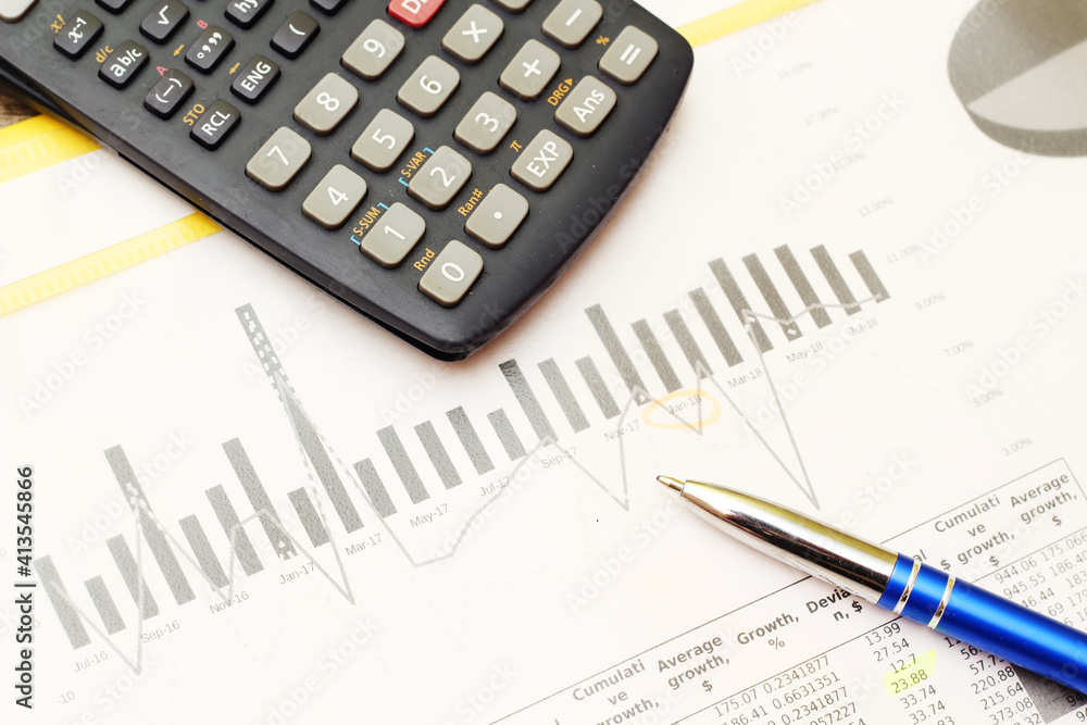 Business concept with a report, money and a calculator Business concept with a report, money and a calculator