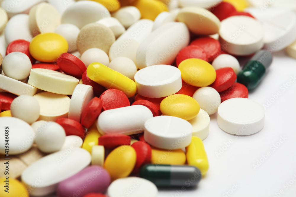 Different colorful tablets at white background Different colorful tablets at white background