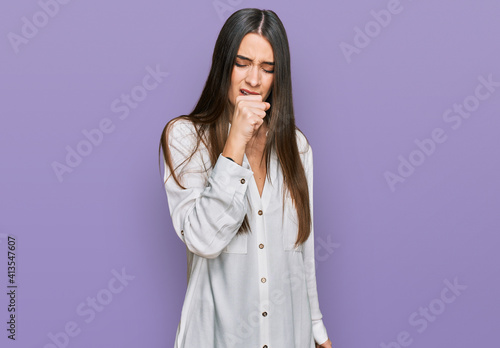 Young beautiful woman wearing casual white shirt feeling unwell and coughing as symptom for cold or bronchitis. health care concept. © Krakenimages.com