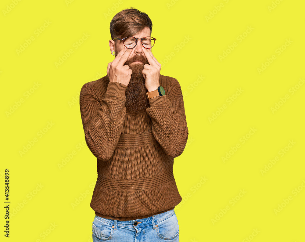 Young irish redhead man wearing casual clothes and glasses rubbing eyes for fatigue and headache, sleepy and tired expression. vision problem Young irish redhead man wearing casual clothes and glasses rubbing eyes for fatigue and headache, sleepy and tired expression. vision problem