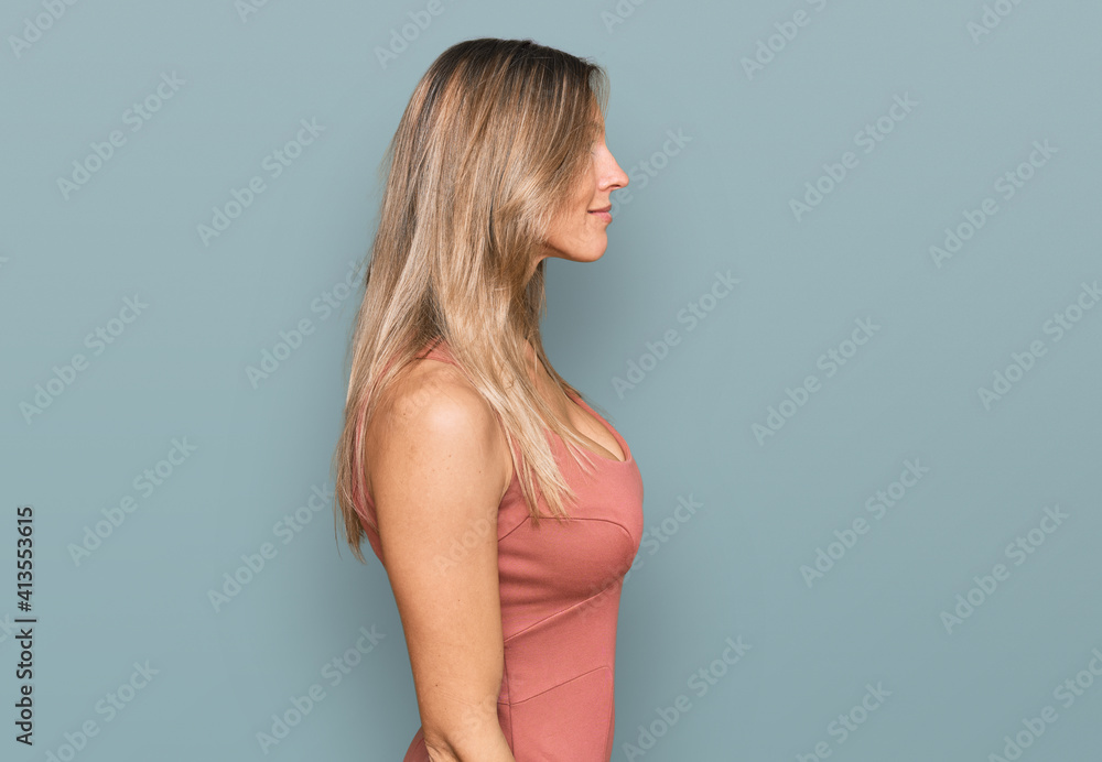 Fototapeta premium Beautiful caucasian woman wearing casual clothes looking to side, relax profile pose with natural face with confident smile.