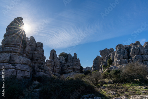 evening light with a sun star in the El Torcal Nature Reserve in Andalusia with strange karst rock formations