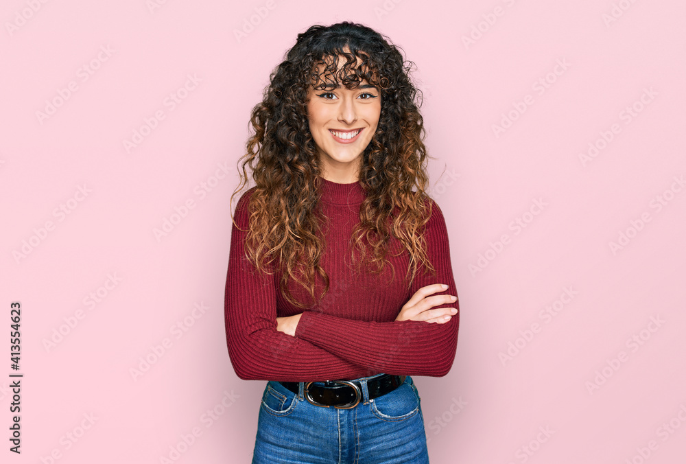Young hispanic girl wearing casual clothes happy face smiling with crossed arms looking at the camera. positive person. Young hispanic girl wearing casual clothes happy face smiling with crossed arms looking at the camera. positive person.