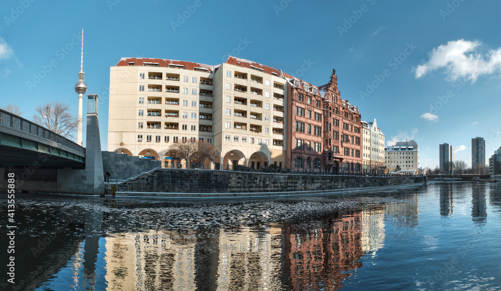 Riverside with old houses in Nikolaiviertel, or Nicholas' Quarter in East Center of Berlin. Wintertime, ice on the river.