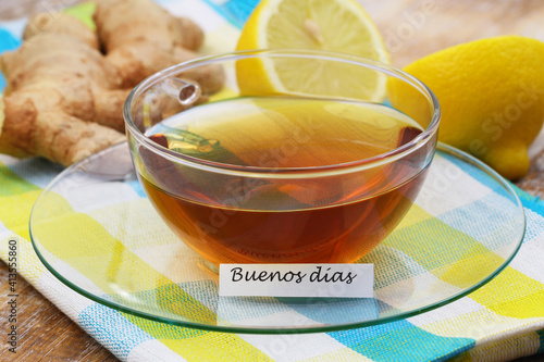 Buenos dias (good morning in Spanish) card with cup of tea, fresh ginger and lemon
