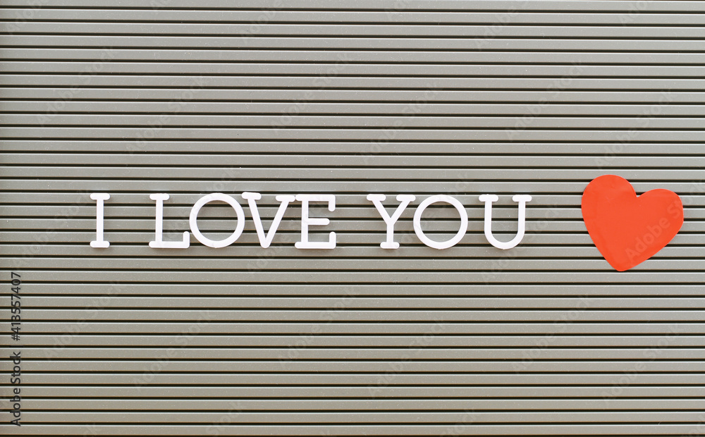 I love you written with plastic letters on metal board