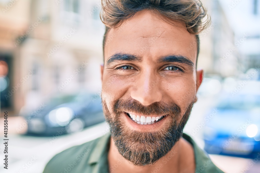Young hispanic man smiling happy walking at the city Young hispanic man smiling happy walking at the city