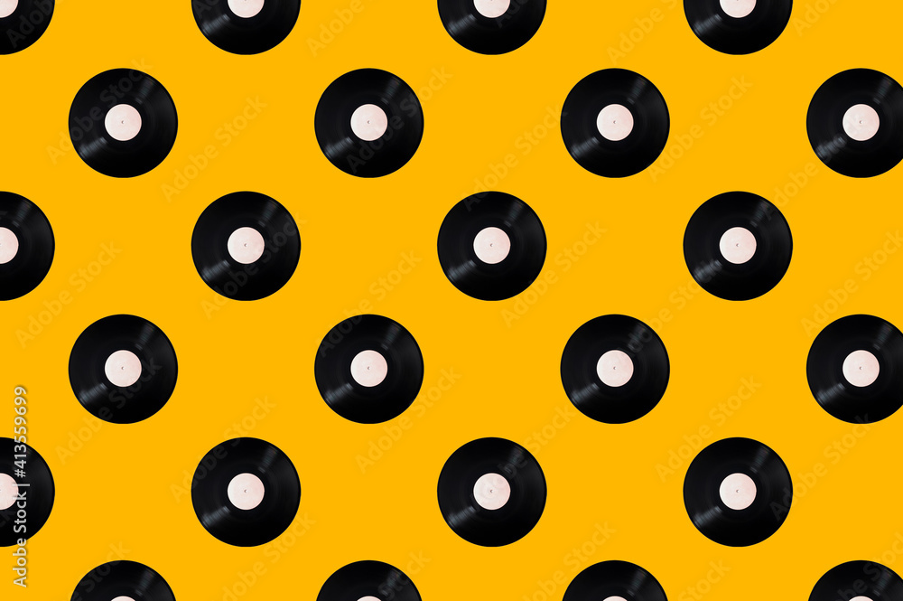 Pattern of vinyl records on a yellow background. Minimal trendy composition Pattern of vinyl records on a yellow background. Minimal trendy composition
