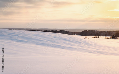 Smooth winter snow covered, north landscape at sunset