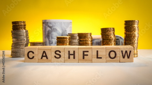 Cashflow wording with coins and money in background. Business concept. Accounting concept.
