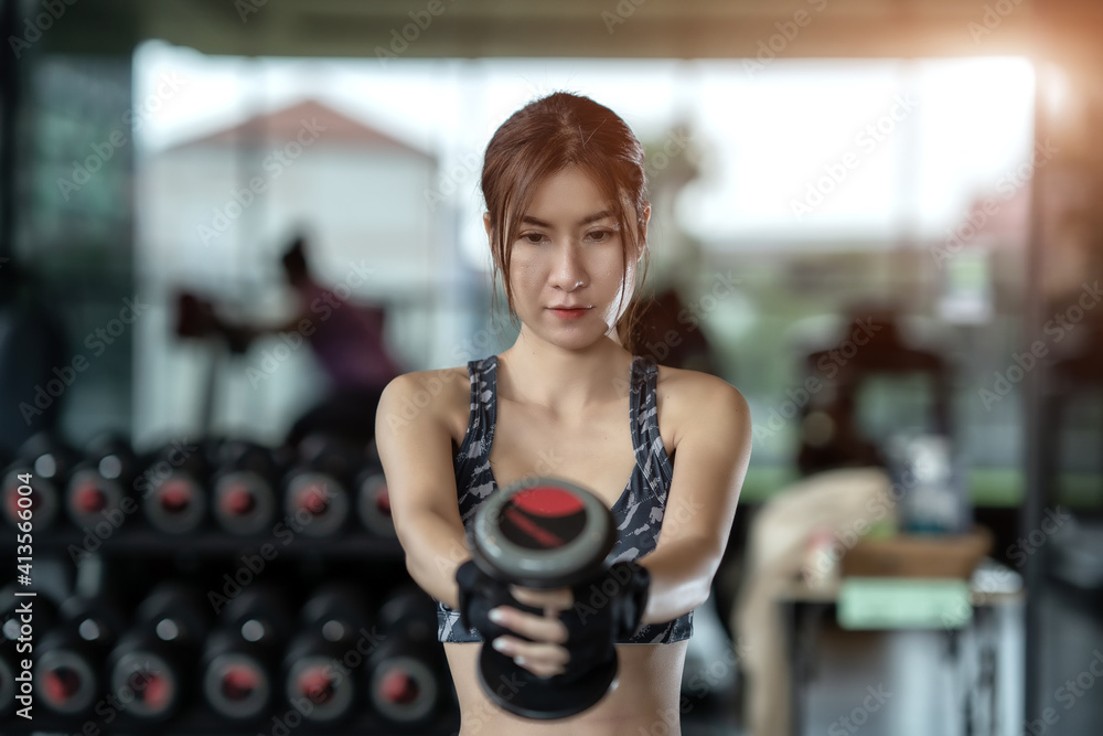 Soft focus consept women are exercising in gym fitness. Beautiful women in good shape from taking care of their bodies. Health concept. 